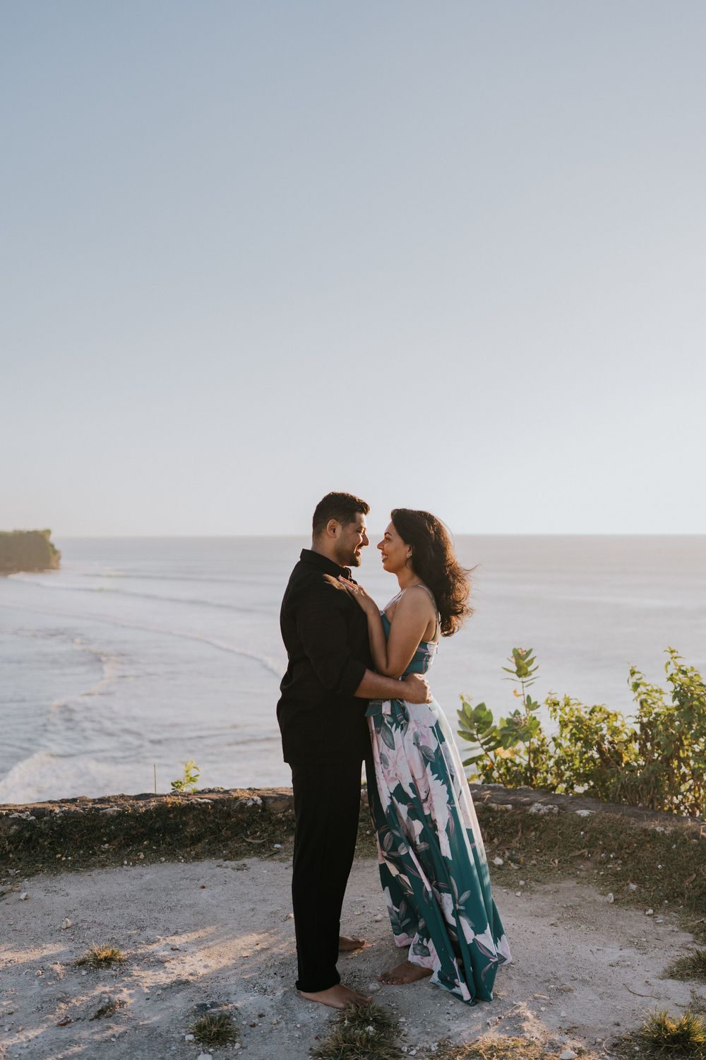 Romantic couple photoshoot at Balangan Beach Bali during golden hour.