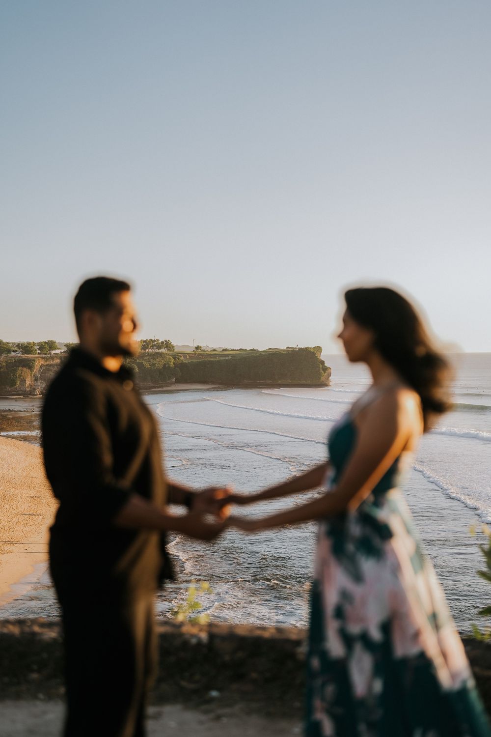 Romantic couple photoshoot at Balangan Beach Bali during golden hour.