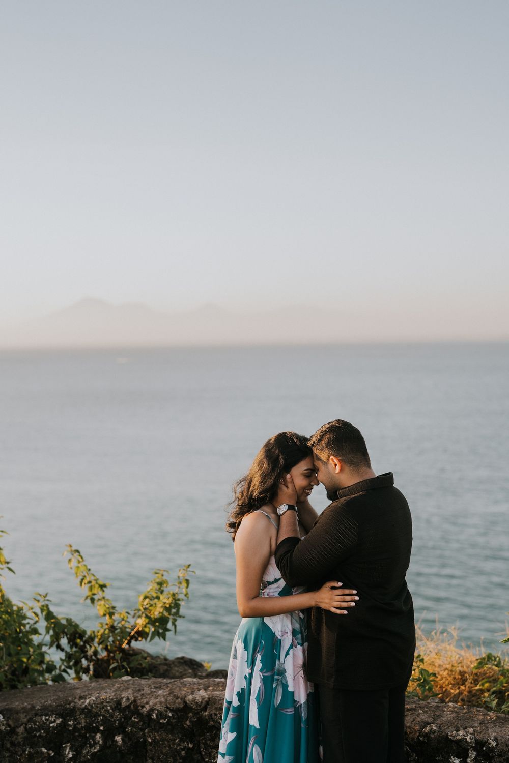 Sunset couple photography session at Balangan Beach with ocean backdrop.