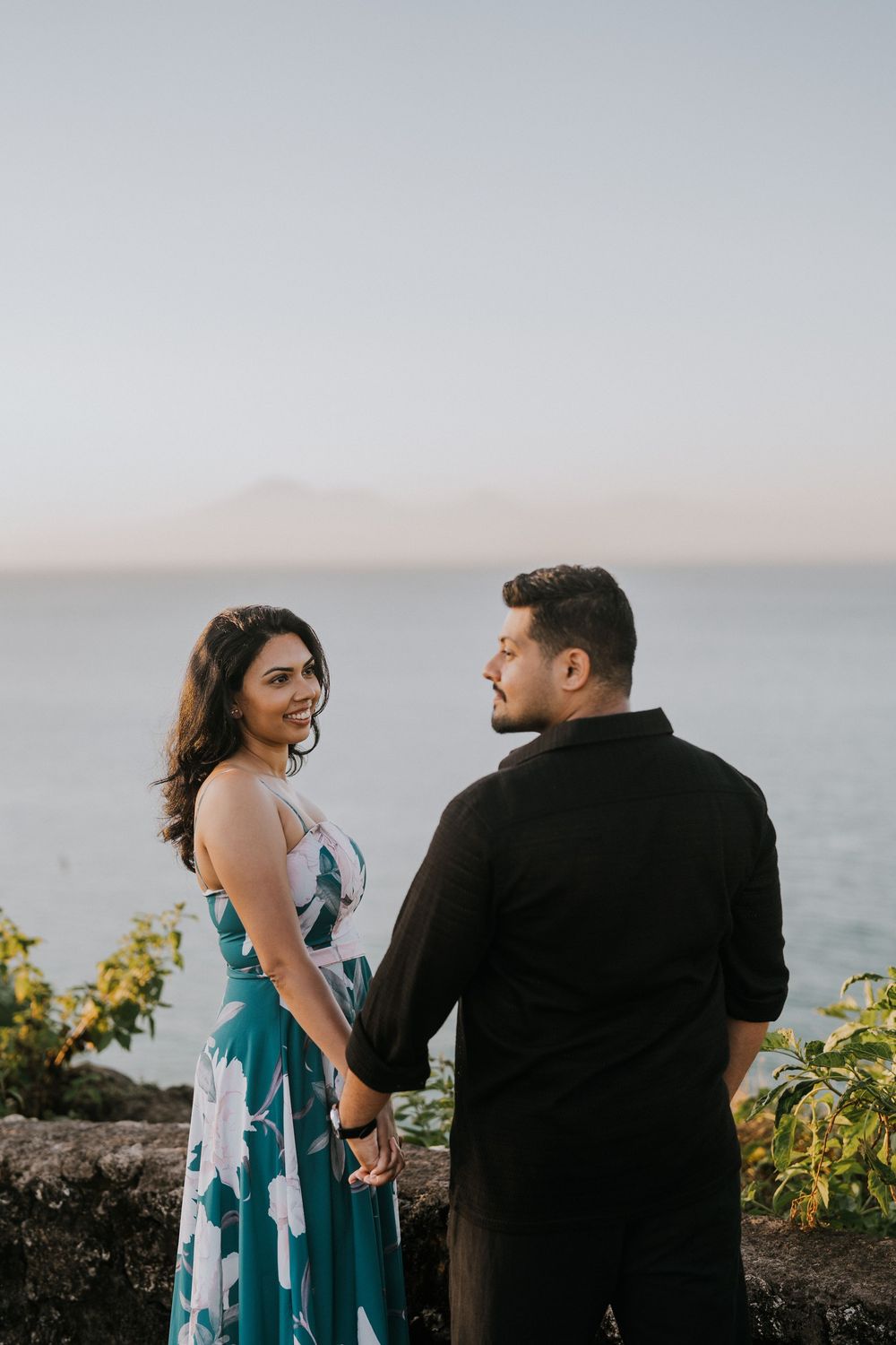 Sunset couple photography session at Balangan Beach with ocean backdrop.