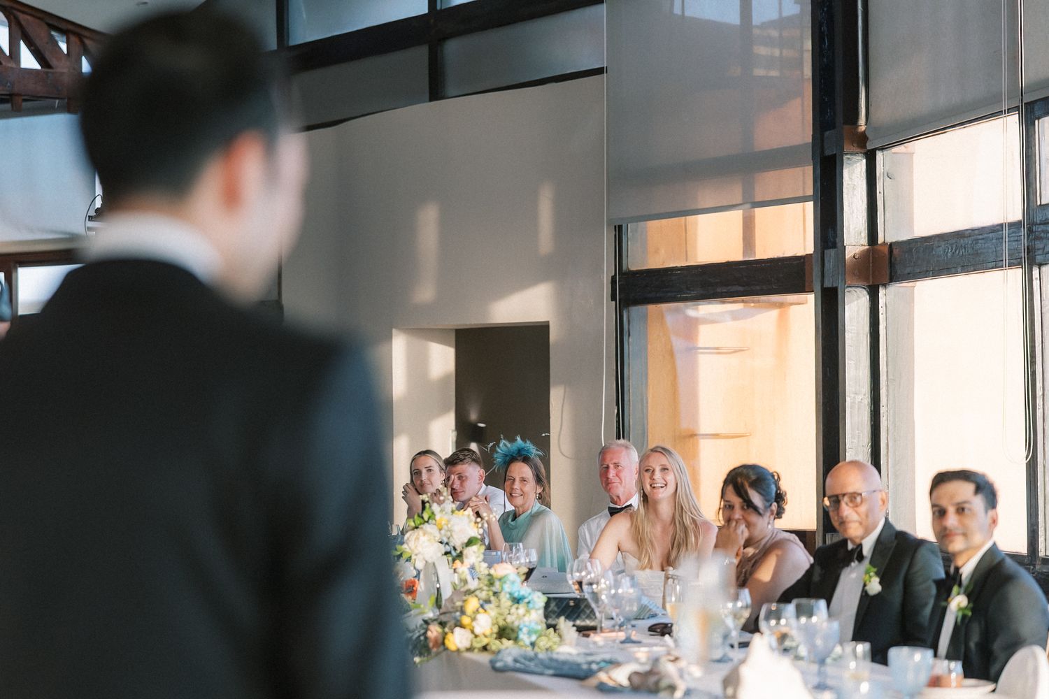 Wedding speeches during an elegant seaside reception in Cascais, Portugal.