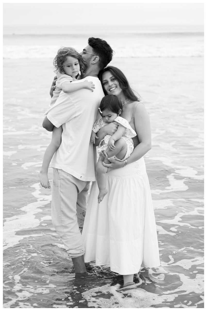 Black and white Family portrait on the beach during a sunset session in Riviera Nayarit.