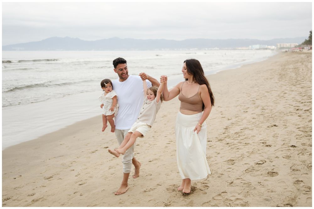 Family walking together by the ocean during a Punta Mita family photography session.