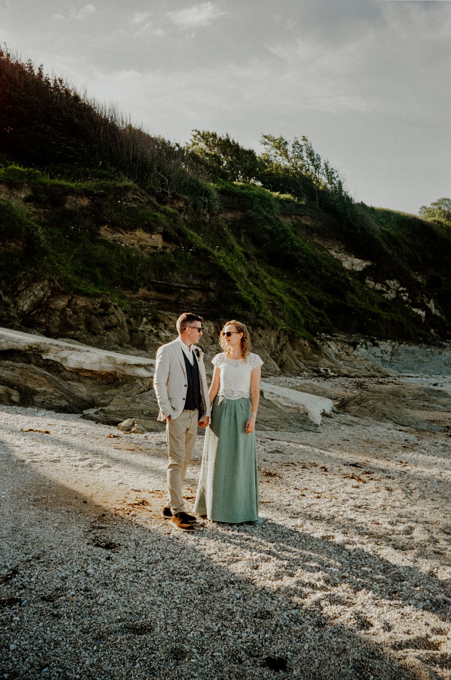 35mm film scan of bride and groom on the beach during sunset portraits at hotel meudon