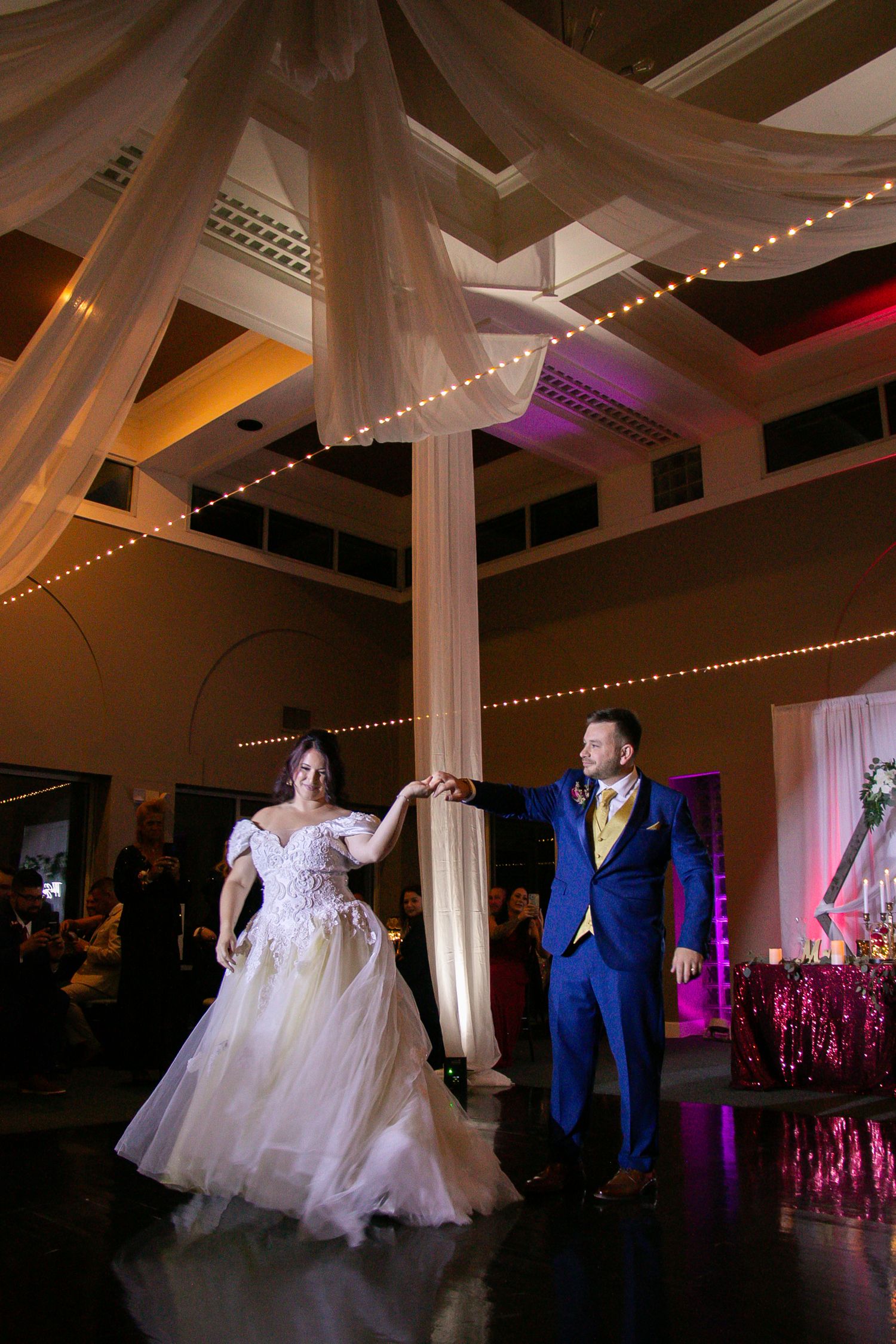Channel Side Club in Palm Coast Florida. Wedding photography of elegant wedding reception. Couple has first dance.