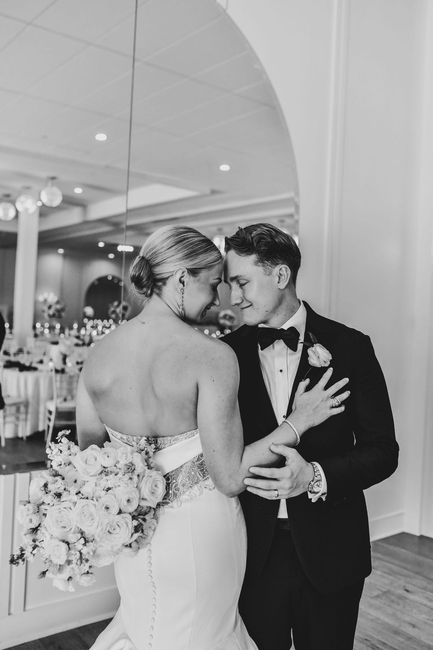 Nicole and Payton smiling during their first dance as husband and wife