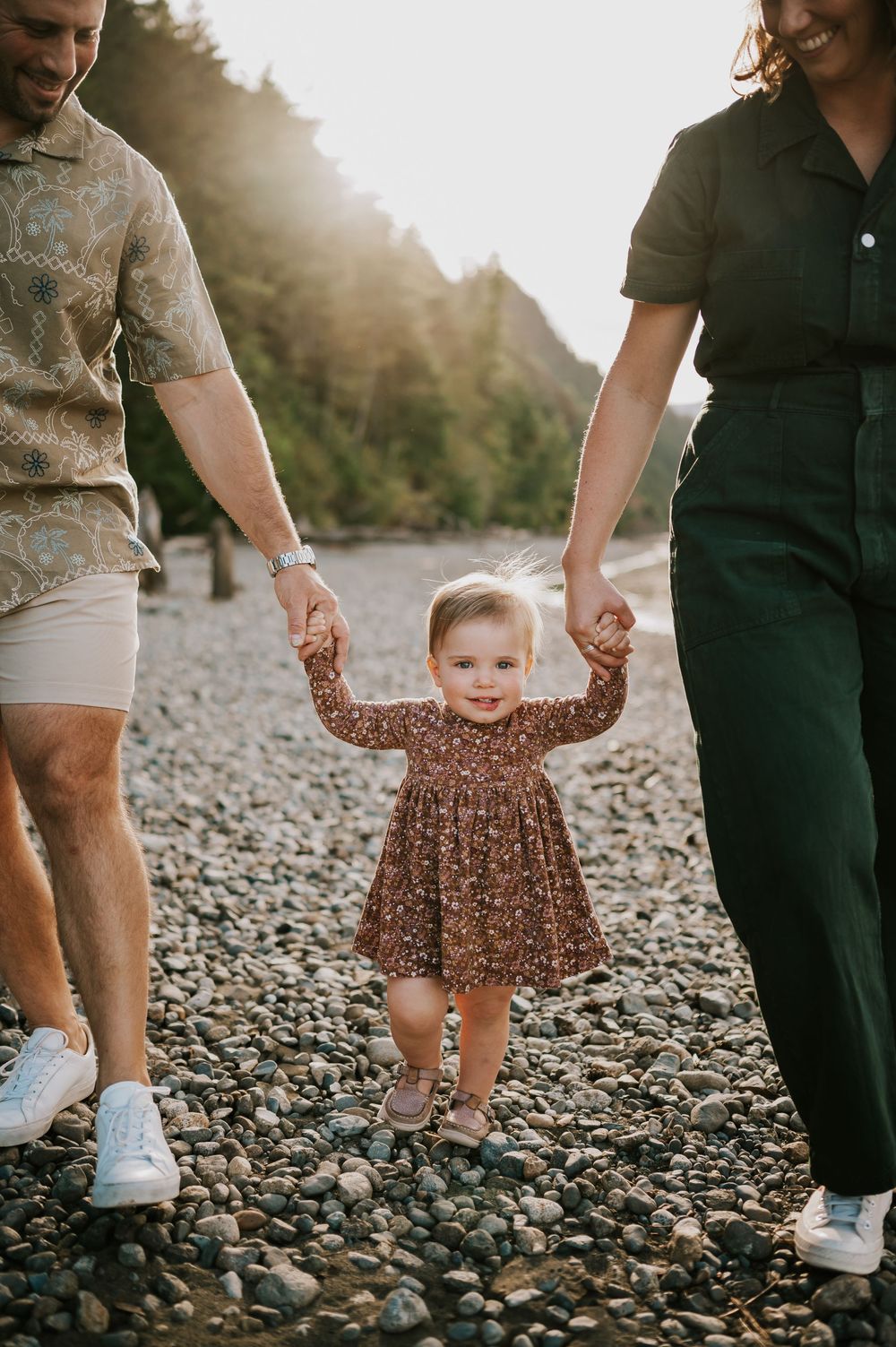 Comox Valley Photographer Portraits at Comox Lake in Cumberland, Vancouver Island. Family holding hands with kid