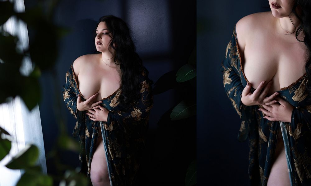 Woman in floral kimono robe posing elegantly in moody dark studio boudoir photography session.