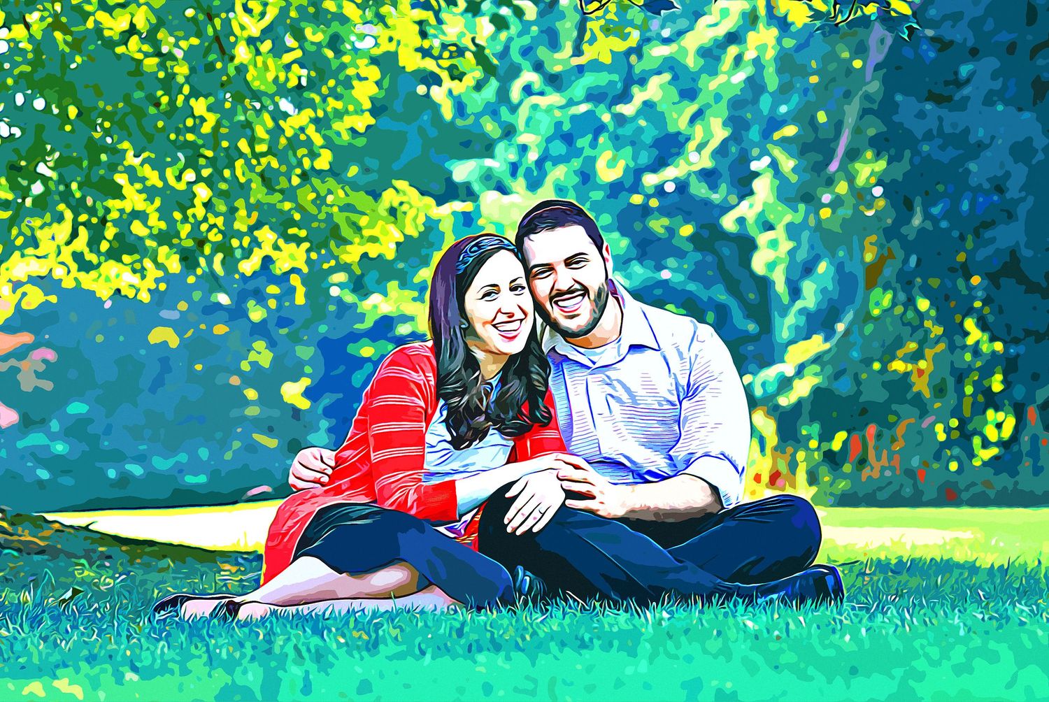 Happy couple sitting on green grass in a sunny park, surrounded by lush trees, smiling together outdoors.