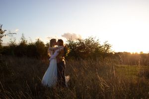 Sunset couples photos of bride and groom at maidens barn on their wedding day