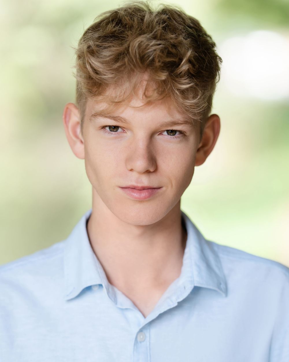A series of headshots showing a young person in a light blue collared shirt against a soft blurred background.