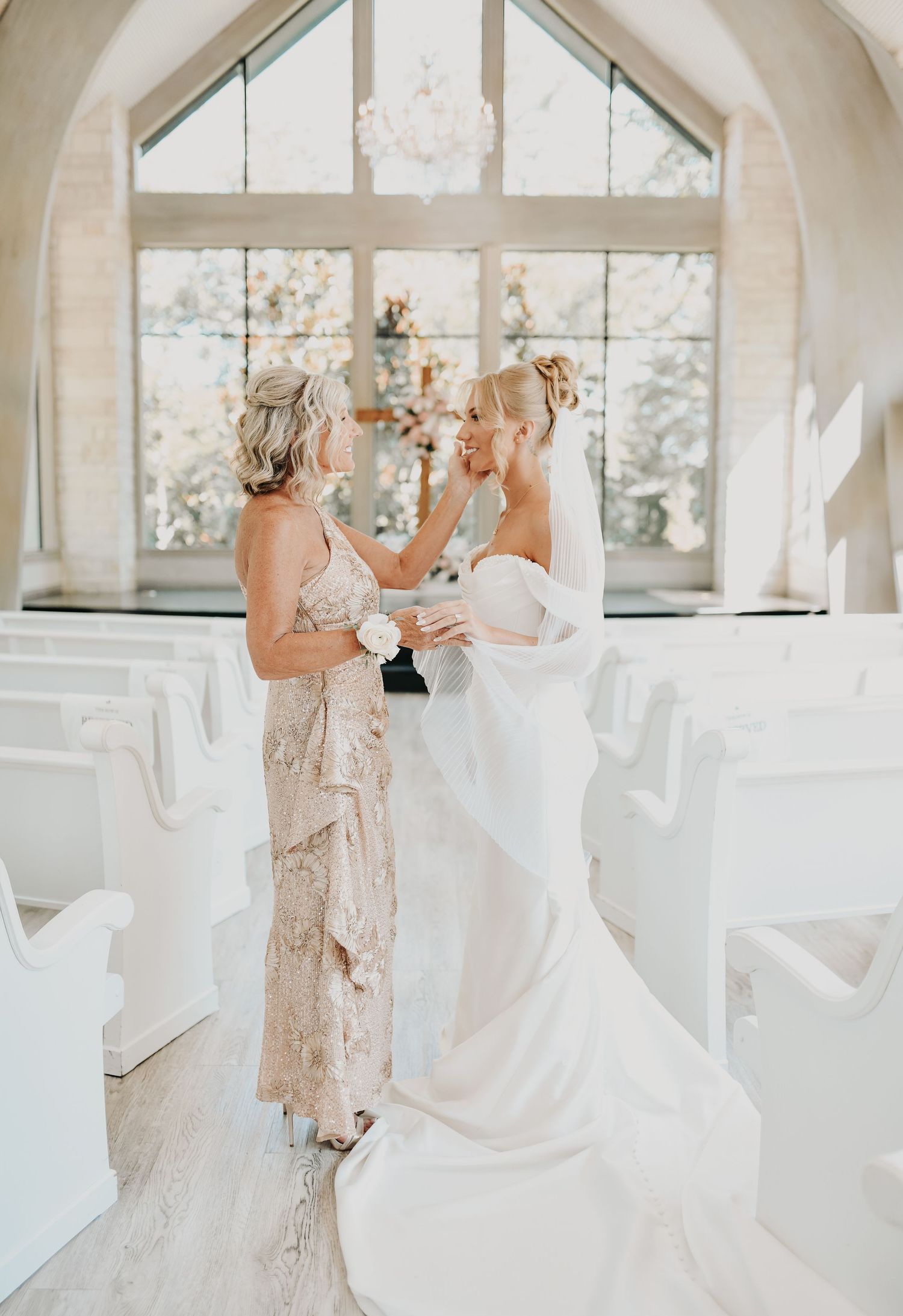 the bride and her mother share a quiet moment
