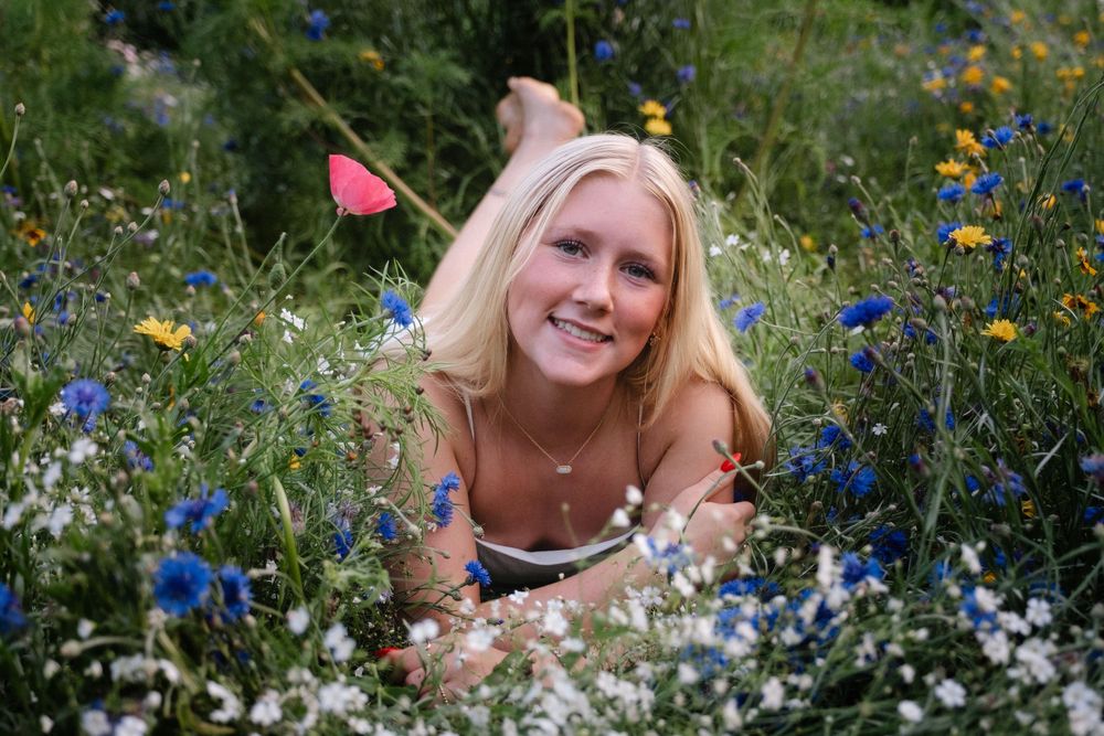 Ella senior portrait session in wildflowers in North Dakota by GMB Photo and Design
