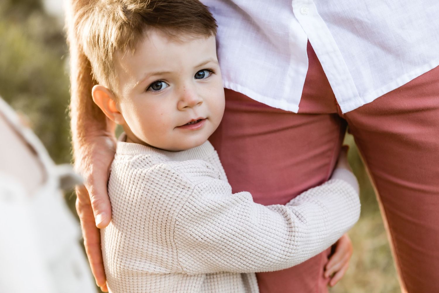 Dad cuddling his two sons during a north Brisbane family portrait session