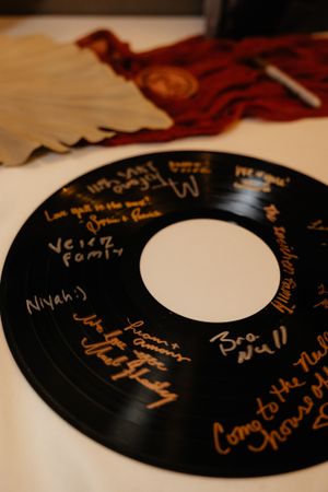 Vintage vinyl records with handwritten messages as wedding guest book alternatives.