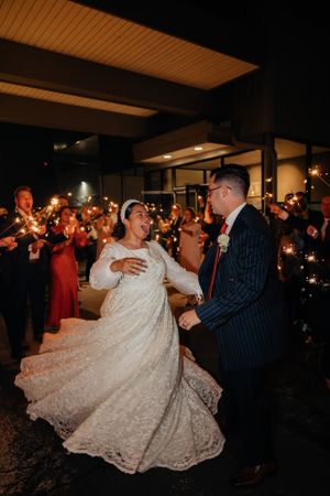 Wedding reception dance with sparklers creating a magical nighttime atmosphere.