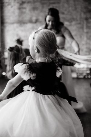 Black and white photo of elegant hair accessories and veil details at wedding.