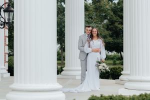 Wedding portrait in front of classic white columns.