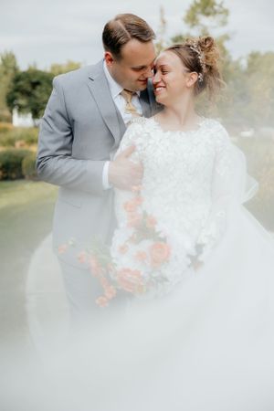 Dreamy wedding portrait with soft focus and romantic lighting effects.