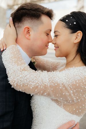 A romantic wedding portrait showing the couple's intimate moment.
