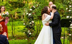 You may kiss the bride.  Wedding ceremony in the woods near Chapel Hill, North Carolina.
