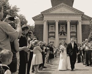 Wedding guests line the walkway outside Perkins' Chapel as a couple exits the Chapel as man and wife.