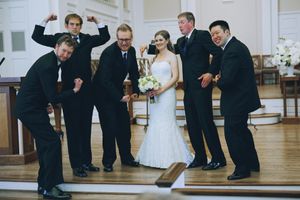 A sequence of fun dance moves is being performed at a wedding reception at Perkins Chapel on the SMU campus.