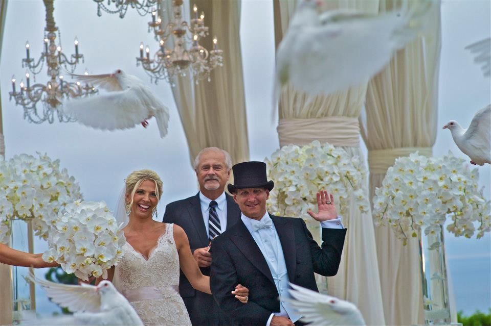 This is how it feels when doves fly.  The newly married couple waves hello to a new life as husband and wife.