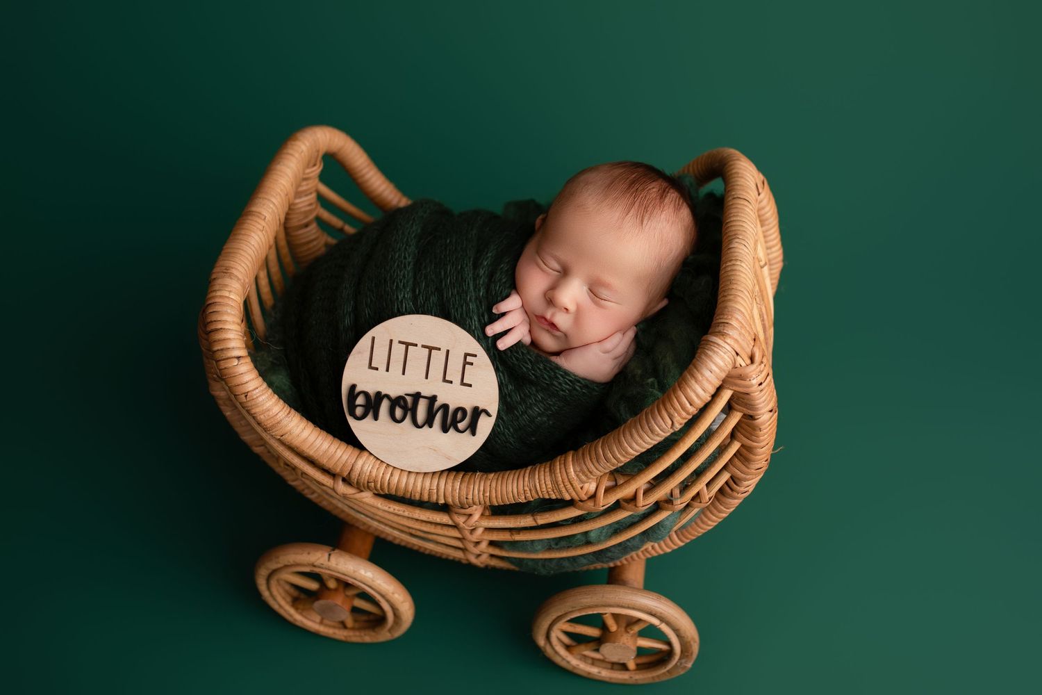 Six carefully staged photos showing brown leather baby items including booties and a miniature carriage against green background.