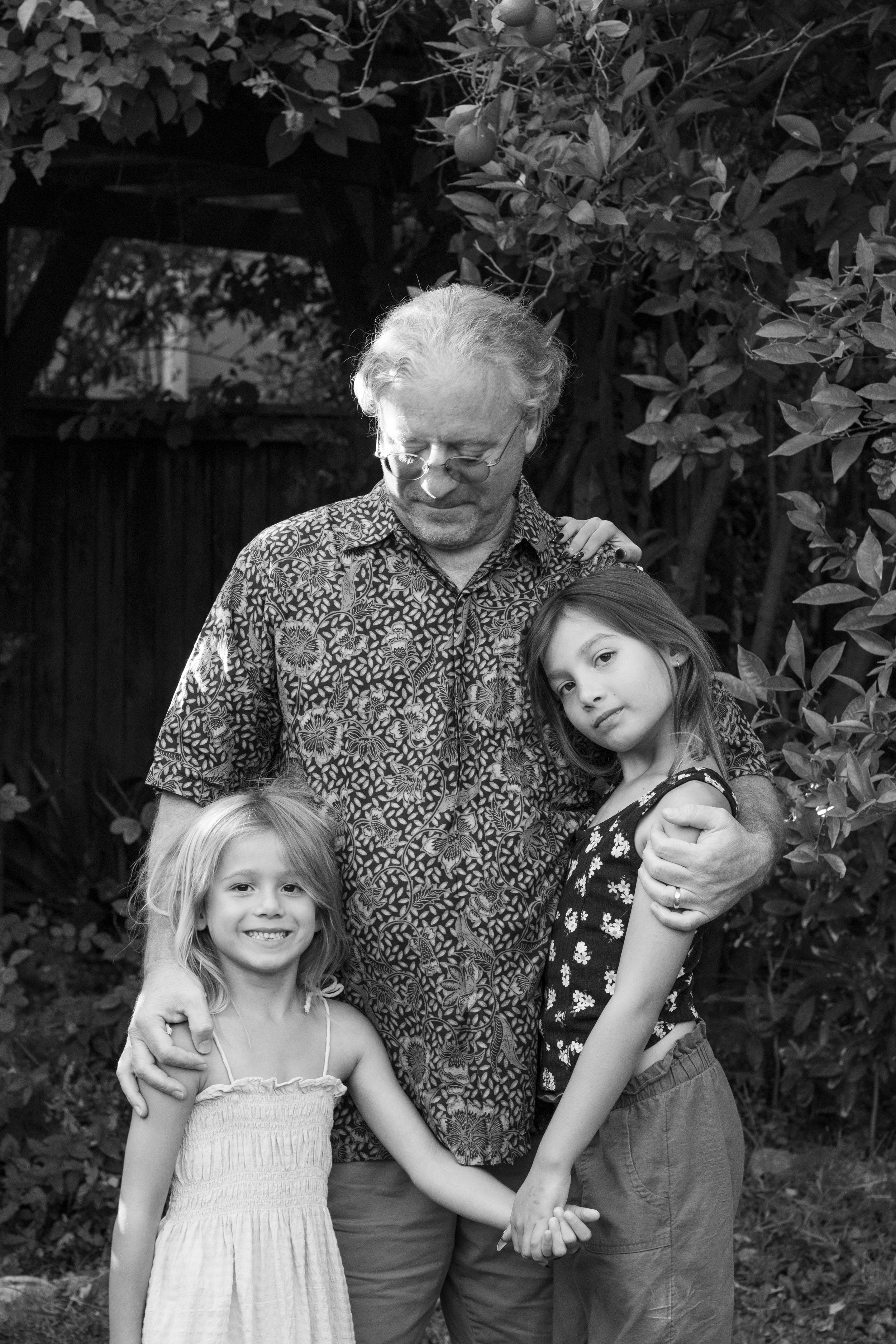 Family Photo of grandfather with granddaughters, black and white