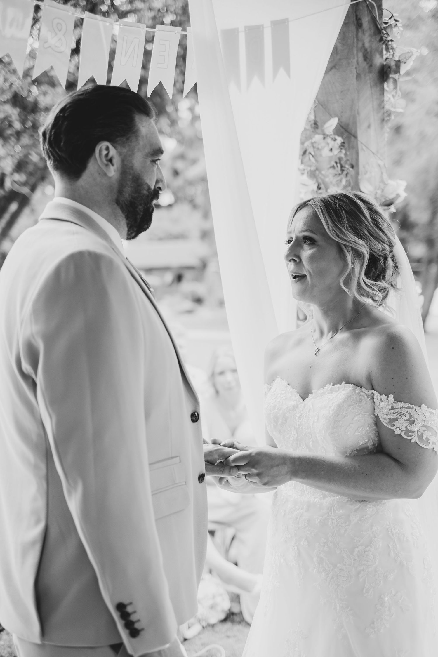 Emotional bride and groom at the front of the aisle on their wedding day at The Old Vicarage, Elkesley