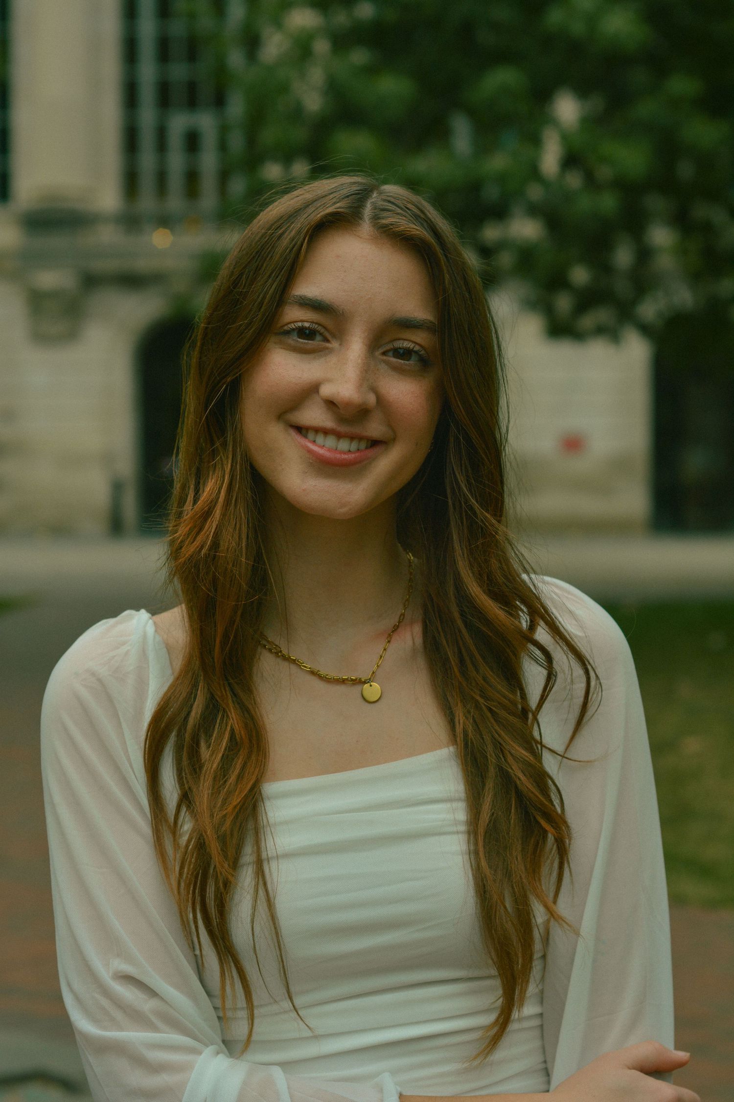 Close-up of a senior at the University of Colorado Boulder, capturing a moment of achievement and excitement on campus.