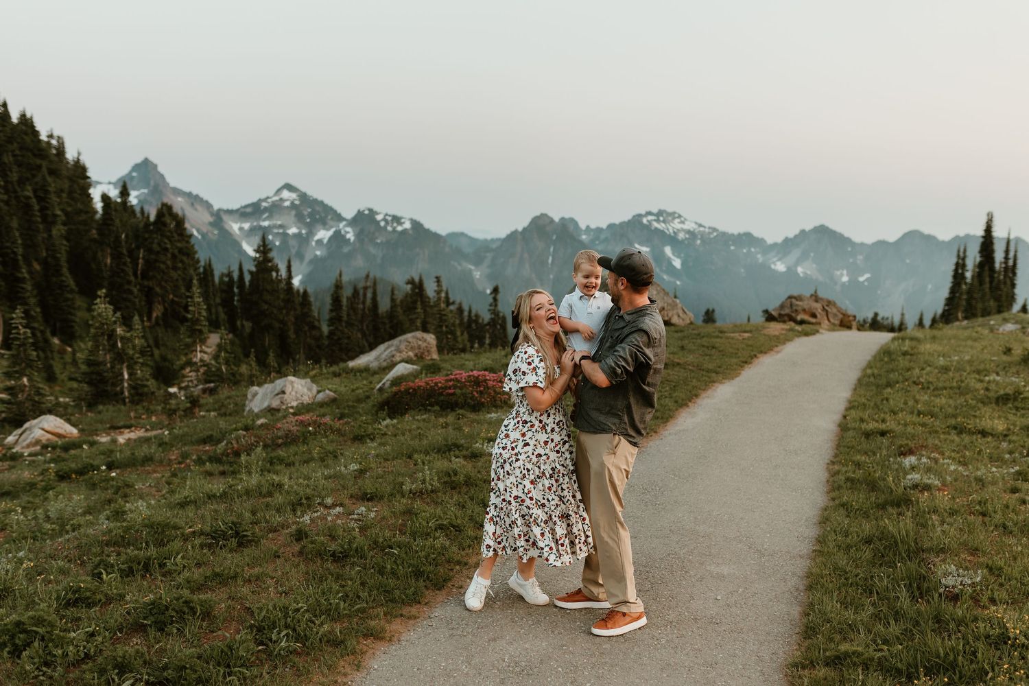 Family of three laughs and plays on trails in Mount Rainier National Park