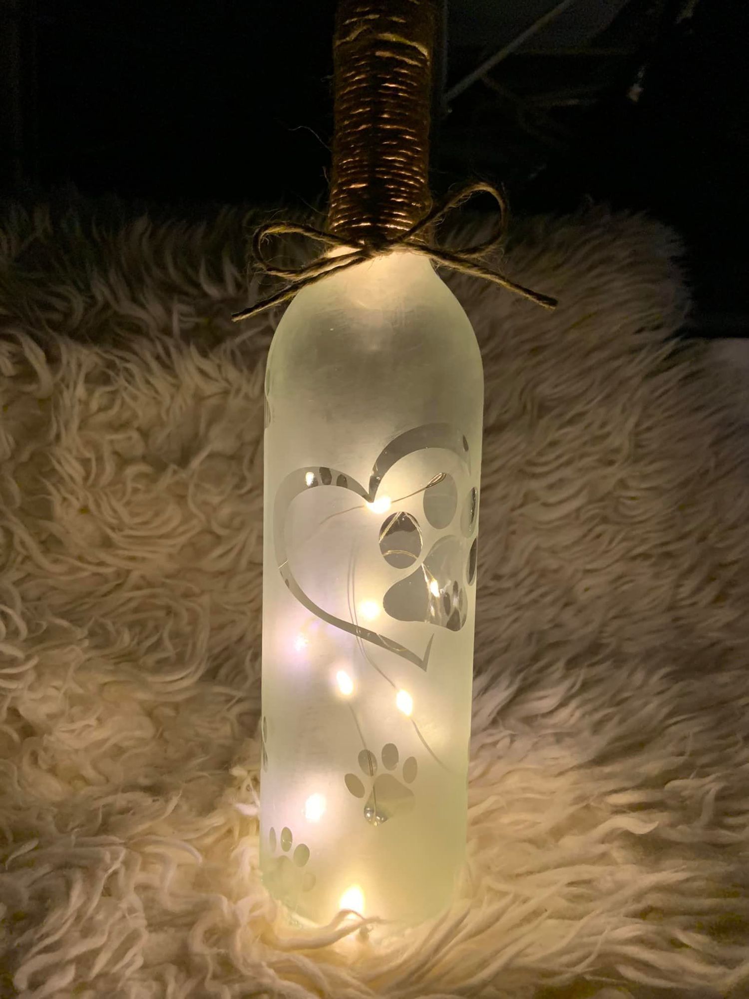 Paw Print with heart and small paw prints on an etched wine bottle