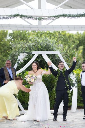 Orlando luxury wedding photographer bride and groom excited at the ceremony for being married.