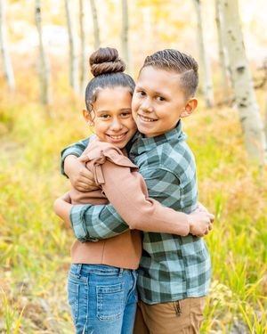 Two kids hugging each other at White Pine Campground.