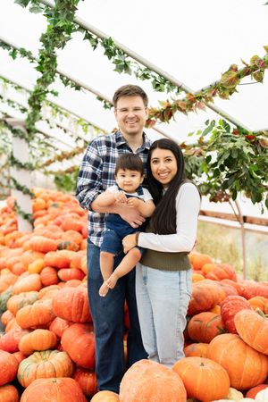 Family at a Kuwahara's pumpkin patch indoors.