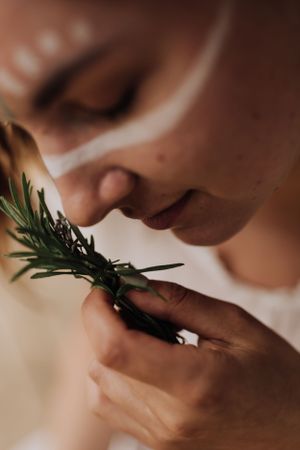 Film still of woman smelling rosemary. Photo by Samantha Bateman.
