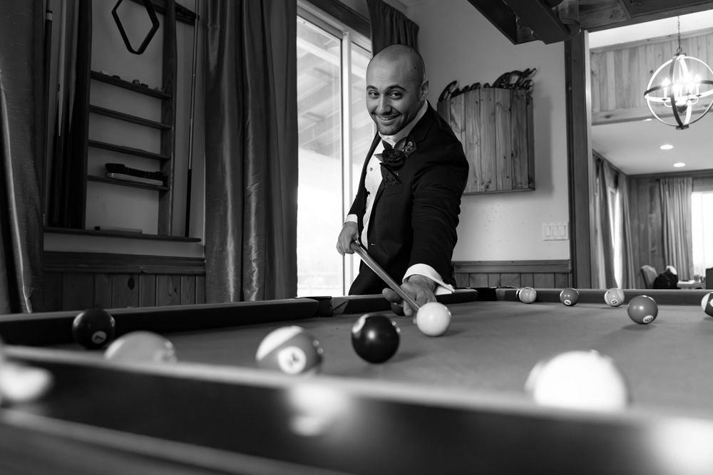 A series of black and white billiards shots showing pool balls rolling across a table in sequence.