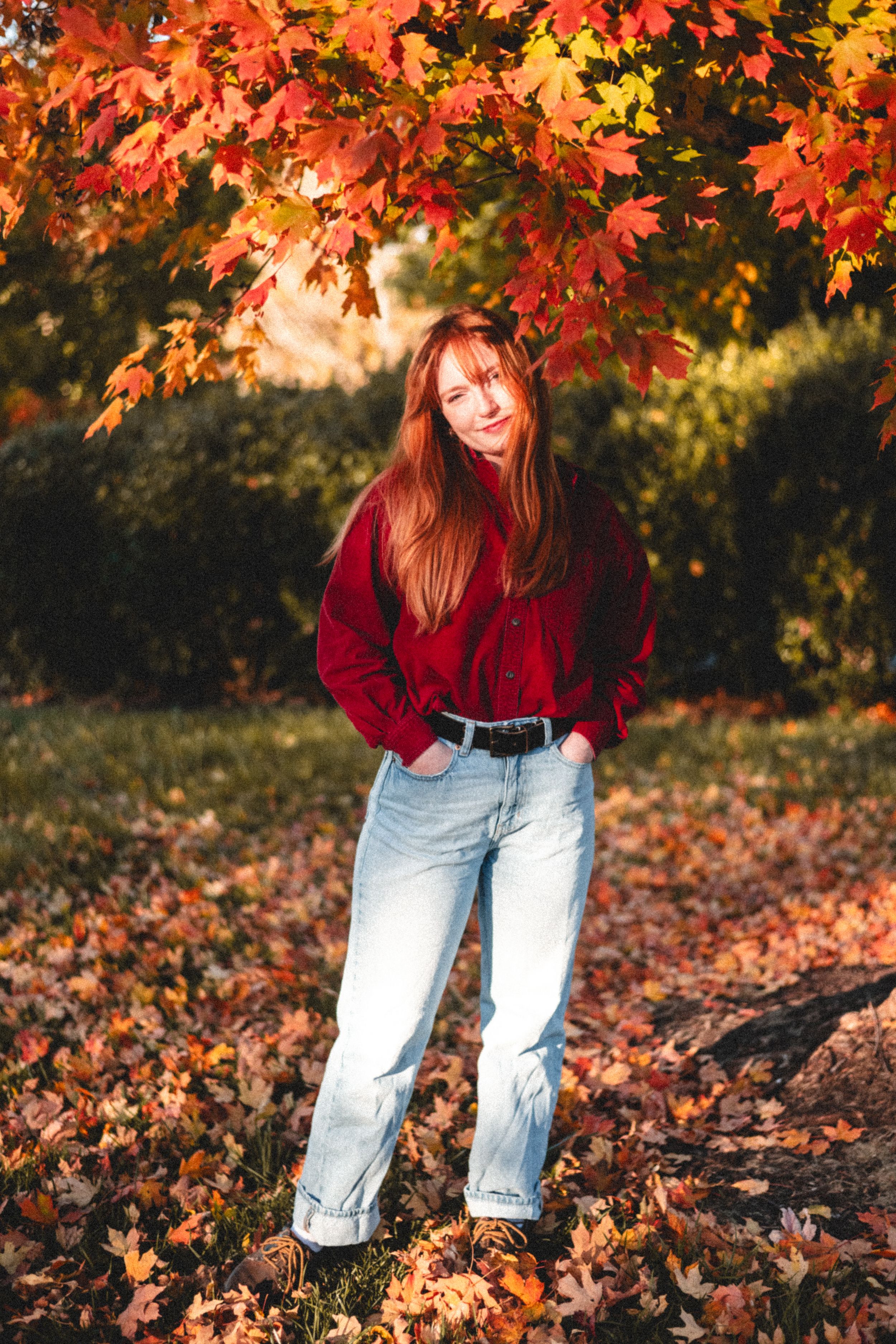 Portrait of a red haired girl in the fall