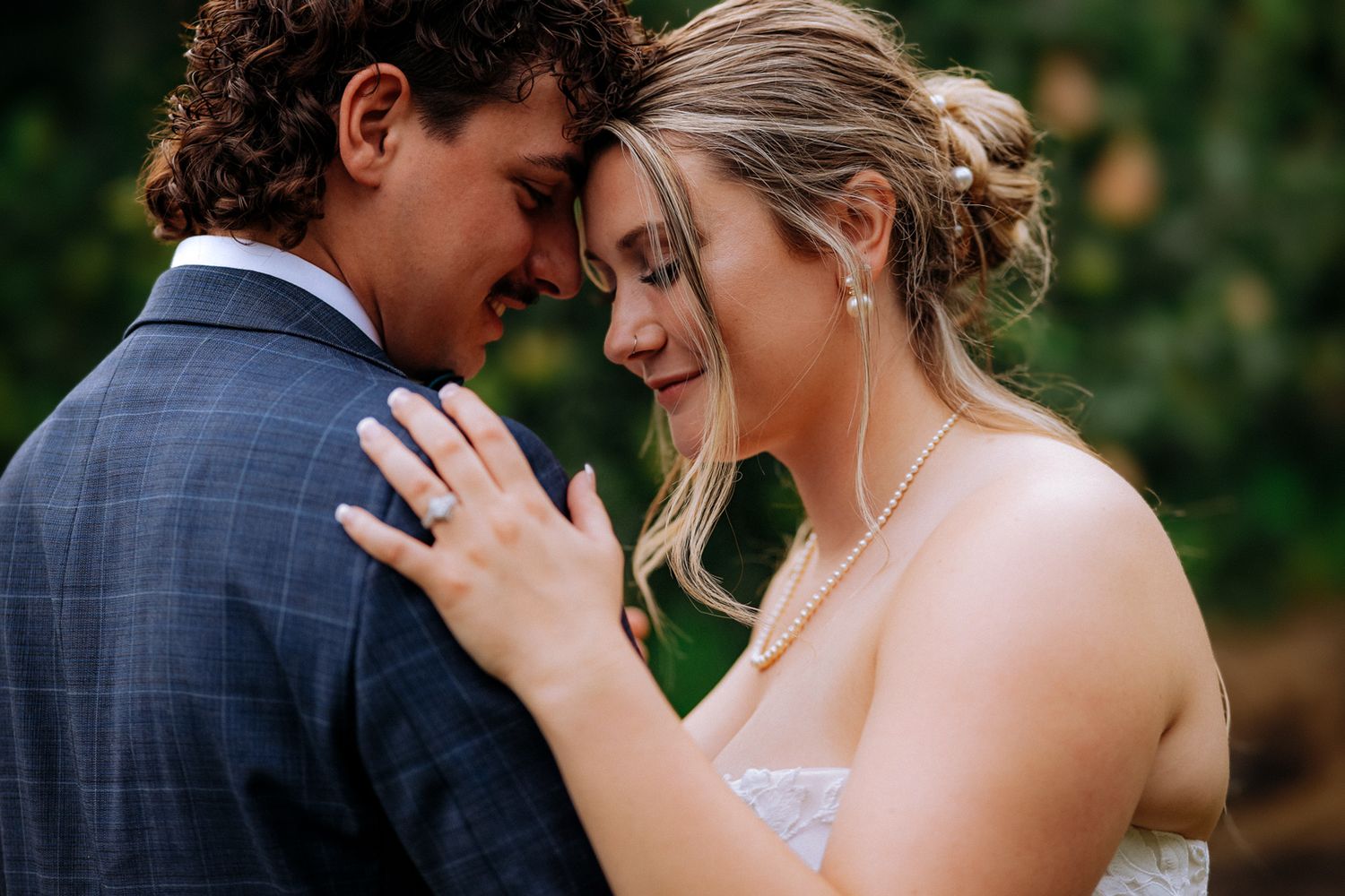 Bride holding bouquet of flowers at Tsillan Cellars outdoor wedding venue