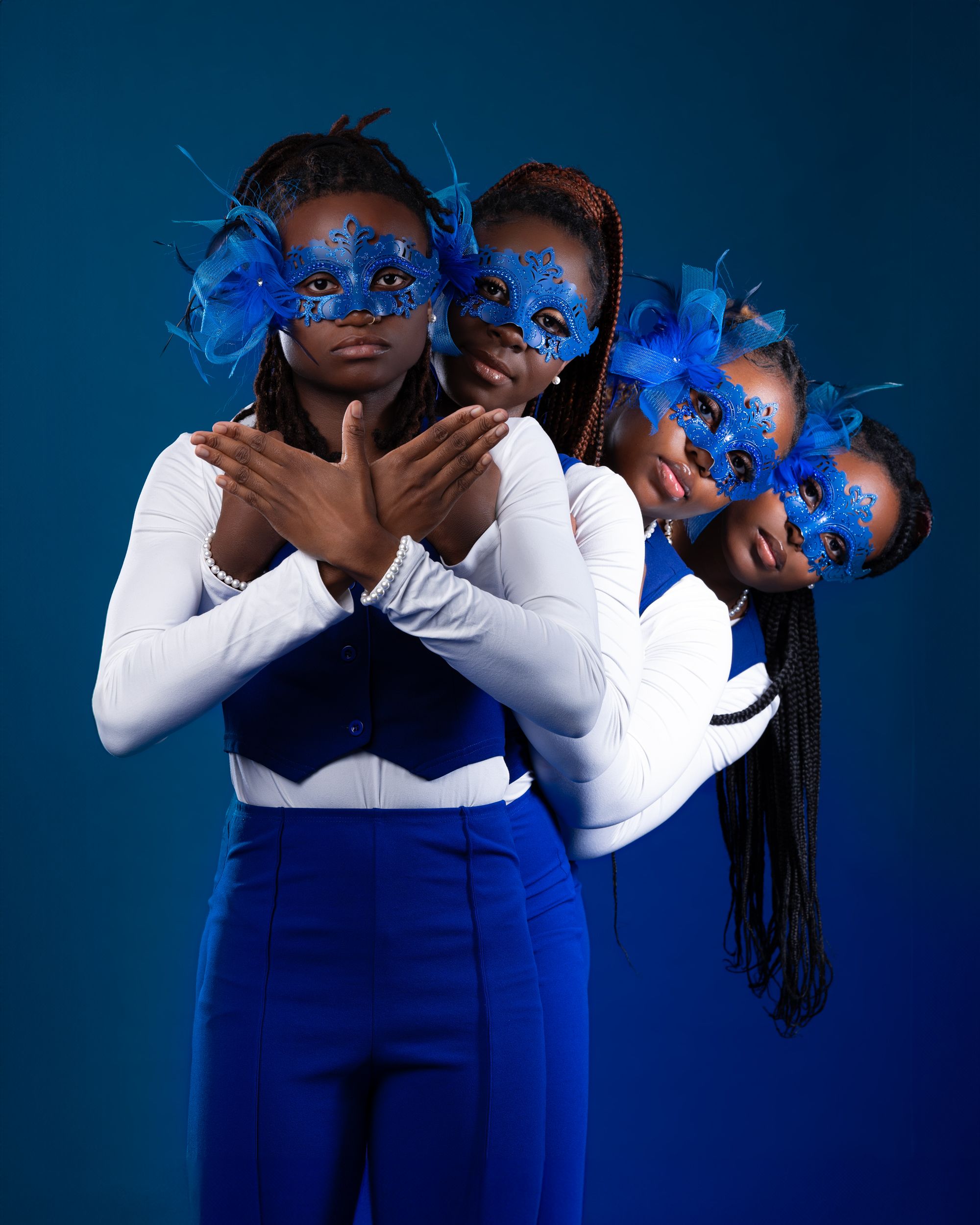 Creative portrait with blue masks and multiple exposure effect against dark blue background.
