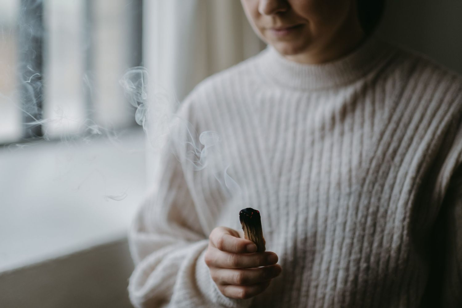 detail of a woman burning scents during personal branding photo session in Stockholm