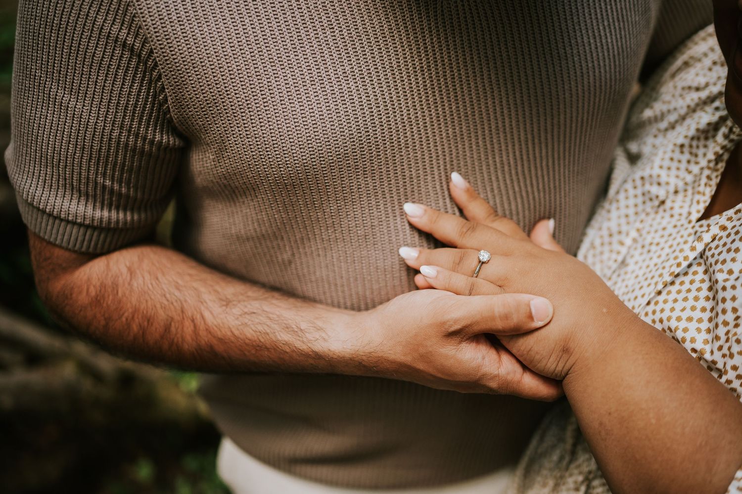 Detail shot of engaged couple hands and ring in Cathedral Groves, MacMillan Park forest. Vancouver Island adventure photographer