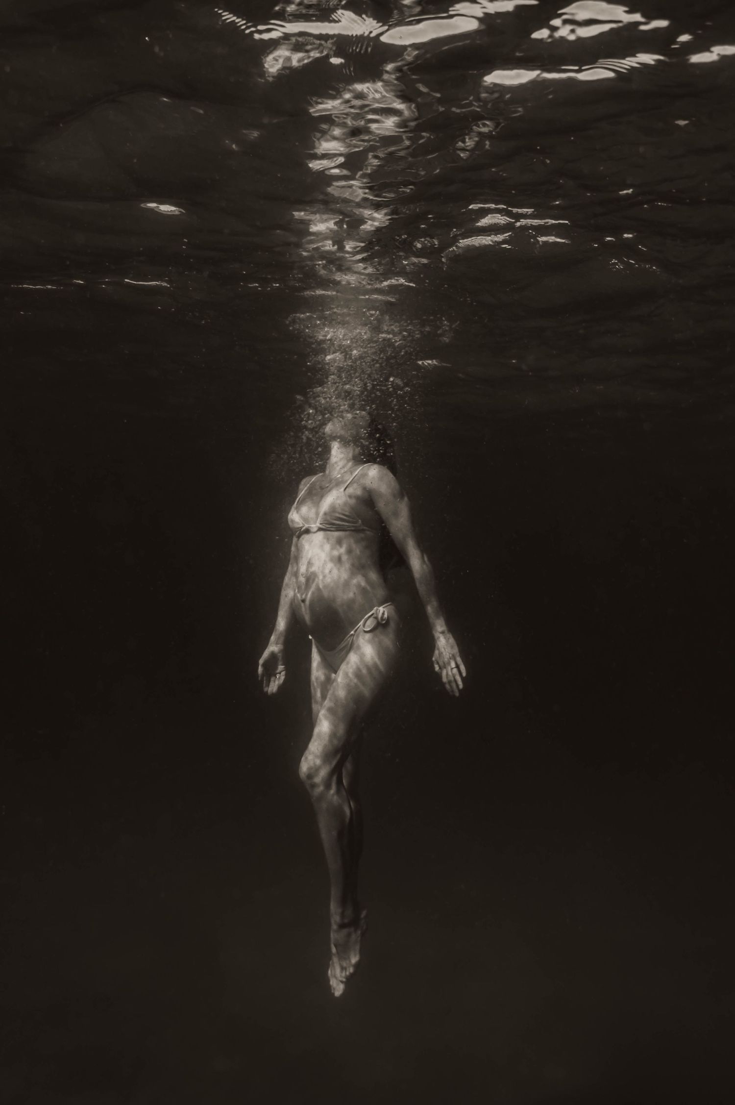 Ocean Maternity Shoot Underwater Surf Photography in Brisbane pool and heated. Beach Photographer family session. Mermaid maternity photos