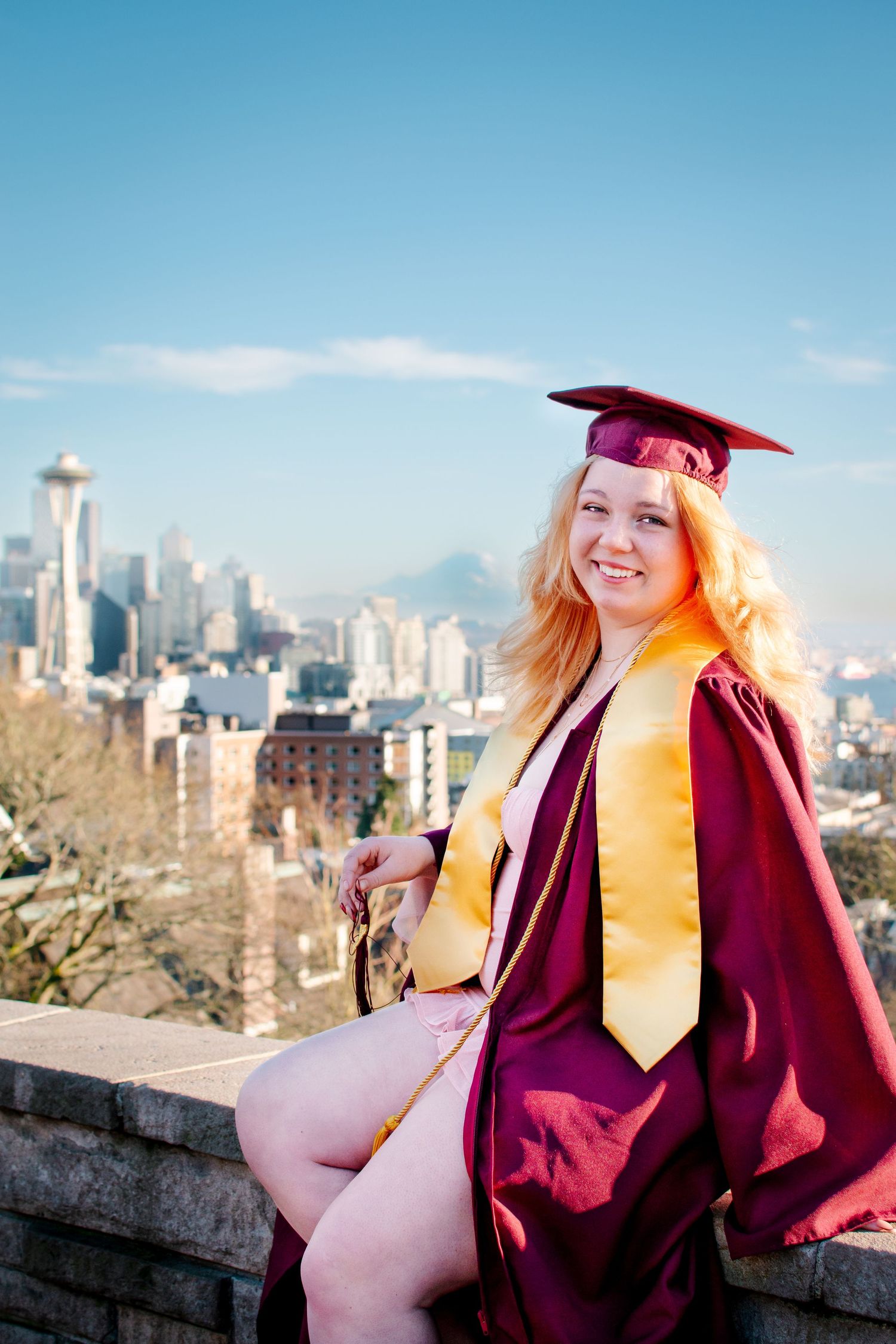 Graduation photo at Kerry Park in Seattle – cap and gown with skyline view for Class of 2025 promo.