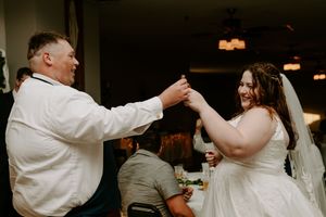 Wedding reception dance floor with couple sharing their first dance.