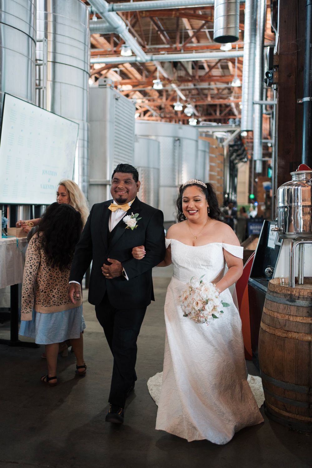 Man and wife walk down the venue as they first arrive to the brewery