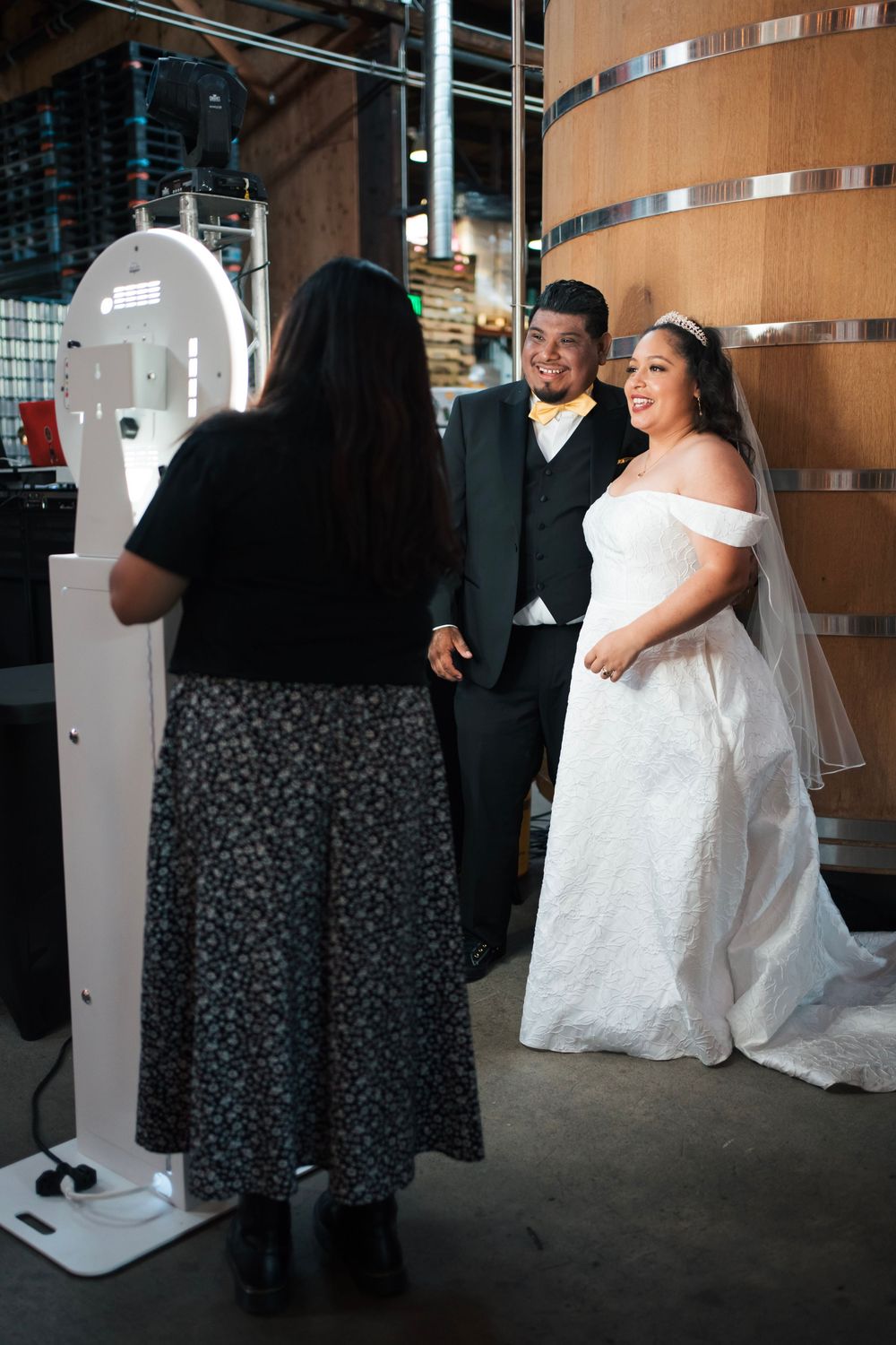 Husband and wife take  a photo at the photobooth