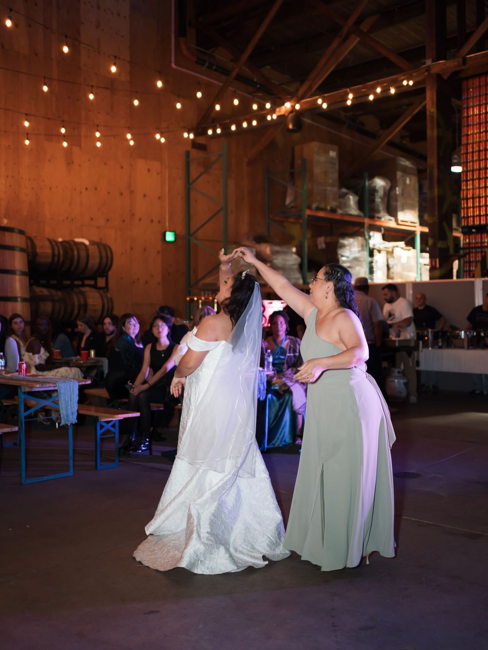 The wife dances with her mom at her wedding in alameda county